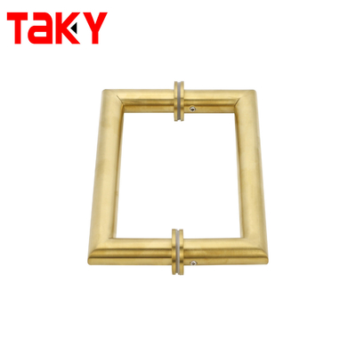 Metalen ronde buis, vierkant, hoofddeur, glazen deur, gouden trekhandgreep.