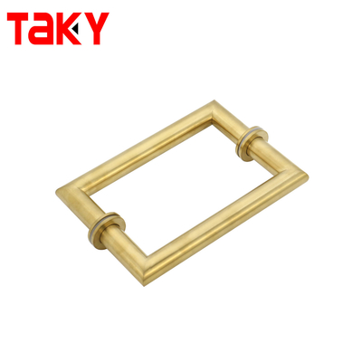 Metalen ronde buis, vierkant, hoofddeur, glazen deur, gouden trekhandgreep.