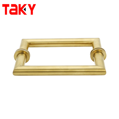 Metalen ronde buis, vierkant, hoofddeur, glazen deur, gouden trekhandgreep.